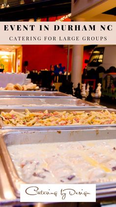 several trays of food sitting on top of a table in front of a restaurant