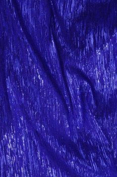 an image of a blue fabric textured with sparkles or sequins on it