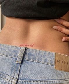 a woman's stomach with the word motel written on it