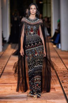 Zuhair Murad looks to Ancient Egypt for Spring 2020 couture line - Murad referenced those with some Deco Egyptian detailing, sending out a dazzling gold number that was bejeweled with hundreds of tiny red, blue and purple sequins and beads that took the shape of various hieroglyphics, tomb paintings, scarabs and eagles to kick off the collection. Haute Couture Zuhair Murad, Egyptian Dress, Ancient Egypt Fashion, Zuhair Murad Dresses, Egyptian Fashion, Egypt Fashion, Haute Couture Wedding Dress, Haute Couture Gowns