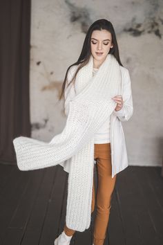 "SIZE: One size - length 78\", width 14\" (~200 cm x  35 cm) Color: Off white (on the picture) and also you can choose from many color options as well Please note that there might be some colors discrepancies due to the different monitor settings. Big fluffy scarf is at the same time very light weight. It's weight is 250 grams only. So you will not actually feel it on your shoulders. A scarf will warm you up in cold indoor environments, during the fall it will be stylish addition to a leather jacket and will protect you if you ever forget your hat. It is very stylish and comfortable accessories.  DETAILS 50% mohair wool, 20% wool, 30% acrylic Model is 5,6\" (175 cm)  HANDMADE. All my knitwear are hand made in Lithuania. Each piece is unique and I take a lot of time and care to create these White Knitted Scarf For Fall, White Cozy Scarves For Fall, Cozy White Scarves For Fall, Cozy White Scarf For Fall, Big White Scarf, Cozy White Winter Scarves, Cozy Knitted White Scarves, Fluffy White Scarf, Wxtra Long Chunky Scarf