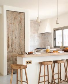 the instagram page shows an image of a kitchen with stools and counter tops