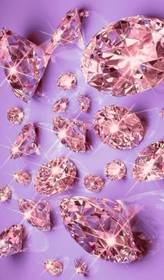 many pink diamonds on a purple background