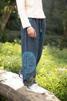 Elevate Your Festival Wardrobe with These Stunning Unisex Stonewashed Baggy Spiritual Pants! Designed for ultimate comfort and style, these unisex stonewashed baggy pants are the perfect addition to your festival wardrobe and everyday look. Crafted from sustainable, eco-friendly cotton, these trousers are ideal for those who value both fashion and the environment. Whether you're dancing at a festival, flowing through yoga, or simply embracing your free-spirited lifestyle, these pants will keep y Baggy Cotton Harem Pants, Relaxed Cotton Harem Pants Ankle-length, Relaxed Cotton Ankle-length Harem Pants, Relaxed Cotton Harem Pants With Elastic Waistband, Relaxed Cotton Harem Pants With Straight Leg, Comfortable Cotton Harem Pants For Spring, Relaxed Cotton Harem Pants For Summer, Casual Cotton Harem Pants For Loungewear, Non-stretch Cotton Harem Pants For Loungewear