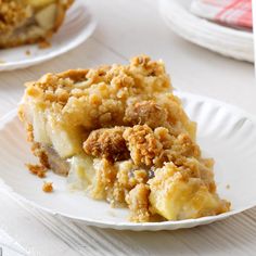 a piece of pie sitting on top of a white plate next to another slice of pie