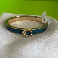 New With Tags, Never Worn, Coach Bracelet. Adjustable Blue Bracelet For Formal Occasions, Chic Coach Bracelet Jewelry, Chic Coach Bracelet, Trendy Blue Formal Jewelry, Chic Coach Bracelets For Gift, Chic Blue Jewelry For Formal Occasions, Blue Coach, Black Bangle, Coach Jewelry