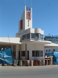 a large white building with a sign that says tachelero