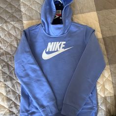 Brand New With Tags. Never Worn. Periwinkle Color. Kids Large Nike Blue Cotton Sweatshirt, Blue Fleece Top For Spring, Blue Fleece Tops For Spring, Blue Nike Hoodie For Fall, Nike Blue Hoodie For Fall, Nike Blue Sweatshirt For Spring, Nike Blue Tops For Winter, Nike Hooded Tops For Spring, Pullover Sweaters Half Zip