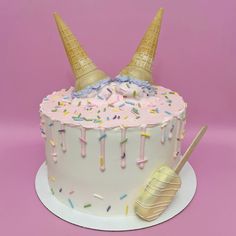 a birthday cake decorated with ice cream and sprinkles