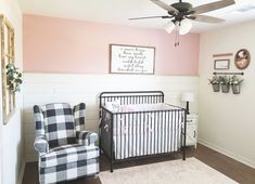 a baby's room is decorated in pink, white and black with plaid furniture