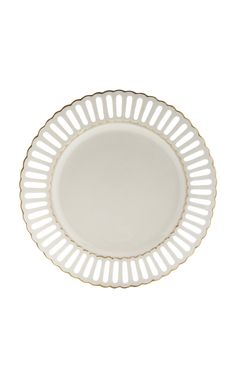 an empty white plate with gold trim