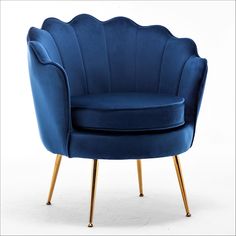 a blue velvet chair with gold legs