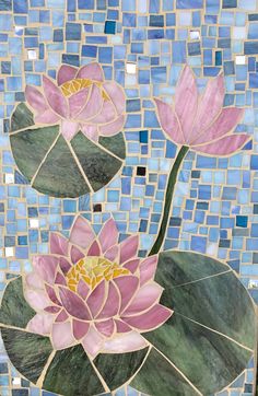 two pink water lilies on top of a green leafy plant in front of a blue mosaic tile wall