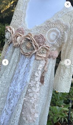 a dress with lace and flowers on it