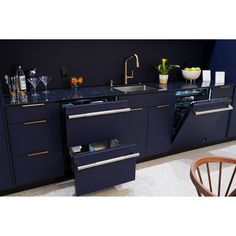 an image of a kitchen setting with blue cabinets