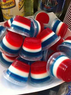 red, white and blue jellopops in plastic containers