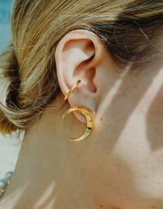 Symmetrical moon-shaped earrings made of sterling silver or sterling silver plated with 24 ct gold. Motif diameter: 24 mm. Decorative engraving on the reverse.We observe the phases of the Moon on Earth trying to solve the mystery of lunar attraction, but one side of this peculiar celestial body is always hidden in the shade of the Sun. Moon And Sun Earrings, Gold Motif, The Phases Of The Moon, Phases Of The Moon, Moon Phases, On Earth, Starry Night, The Moon, Silver Gold