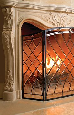 a fireplace with a fire burning inside of it