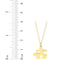 Send along your love with this charming puzzle piece necklace. Crafted in 14K yellow gold The flat puzzle piece pendant features a cutout heart The 16-inch rope chain with 2-inch extender secures with a spring ring clasp Yellow Heart Charm Jewelry For Anniversary, Pear-shaped Yellow Necklace For Gift, Puzzle Necklace Couples, Puzzle Piece Bracelet, Puzzle Piece Necklace, Rope Chain, Puzzle Pieces, Spring Rings, Yellow Gold