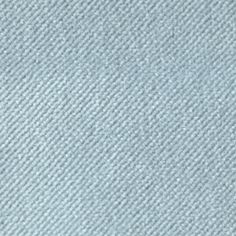 a close up view of a light blue carpet