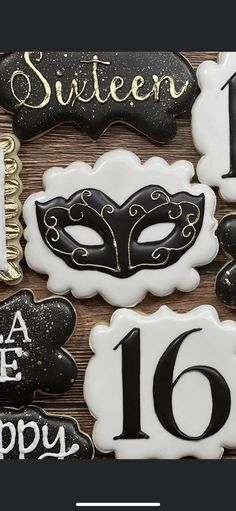 decorated cookies with black and white icing for a masquerade party