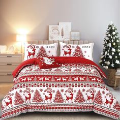 a red and white bed with christmas decorations on the sheets, pillows and pillow cases