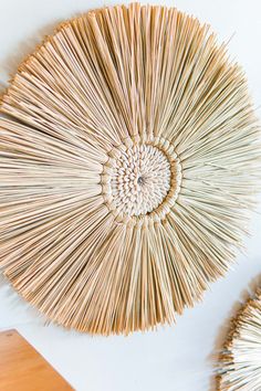 the wall hanging is made out of straw