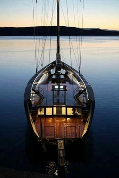 an image of a boat that is in the water at night with text reading open in tumbi follow