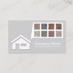 a business card with a house and different types of tiles on the front, in grey tones