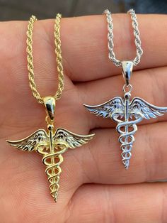 "Beautiful handmade Caduceus pendant Great gift for someone in the healthcare industry! 14k yellow gold or rhodium over SOLID 925 SILVER...Great investment! 1\" (1.25\" w. bale) Pendant weighs 4 grams! VERY DETAILED. Amazing handmade piece Real silver will never tarnish or turn your neck green You can buy pendant alone or with choice of 2mm solid 925 silver chain (either rhodium or gold finish) Chain is Made in Italy & comes in 16-30\"" Doctor Jewelry, Emt Paramedic, Gold Chain With Pendant, Nurse Doctor, White Gold Chains, Healthcare Industry, Gold Plated Chains, Cz Stone, Chain Pendants