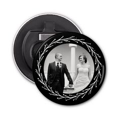 a black and white photo of a man and woman holding hands in front of a circular frame