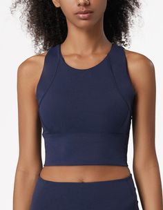 The EMES SHOP sports bra is detailed with a high round scoop neckline. thick tank straps. a built-in lined bra. and cropped fit. Features a thick waistband and acontouring seaming. This light-weight. quick-drying. buttery soft compressing sportsbra features all the support and comfort you need. while still looking cute.MATERIAL:75% Nylon. 25% Spandex MEASUREMENTS:Small : 4-6 Waist: 25-26.5 in Chest: 33-34.5 inMedium : 6-8 Waist: 26.5-28 in Chest: 34.5-36 inLarge : 8-10 Waist: 28-29.5 in Chest: 3 Gym Clothes Women, High Impact Sports Bra, Yoga Top, Yoga Tank Tops, Sports T Shirt, Crop Top Bra, Training Tops, Yoga Bra, Yoga Tops