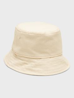 A classic bucket hat made in soft, washed canvas.  Circumference: S/M 24" (61cm), L/XL 25" (63. 5cm) Brim width: 2. 375" (6cm) Classic Brimmed Bucket Hat, Classic Solid Bucket Hat With Short Brim, Classic Solid Color Bucket Hat With Short Brim, Outdoor Cream Cotton Bucket Hat, Casual Cotton Bucket Hat With Curved Brim, Casual Canvas Bucket Hat With Curved Brim, Cream Cotton Bucket Hat, Outdoor Canvas Bucket Hat With Short Brim, Adjustable Canvas Bucket Hat With Flat Brim