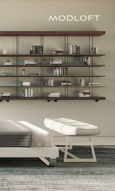 there is a bed with bookshelves on the wall