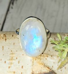 "Natural Premium Grade Oval Moonstone .925 Sterling Silver Ring Size 7.5 weighs 6.7 Grams measures 15/16\" x 5/8\" GS19. Much more blue flash than picture shows! This is a handpicked natural stone, the exact one shown in picture.  The sterling silver is .925 and stamped.  Each piece is hand made by artisans in my shop.  The quality of the stones and the silver workmanship is impressive.  Please look at other items in my store.  I sell ready made jewelry with hand crafted silver work, pendants with a sterling silver bails and beautiful unique cabochons for jewelry wire wrapping and weaving. You will pay exact amount on shipping plus $1 for supplies and labor. All items are shipped within a couple of days after payment and are shipped USPS first class or international first class.  Items are Mystical Moon-shaped Sterling Silver Moonstone Ring, Jewelry Wire Wrapping, Moonstone Ring Sterling Silver, Ring Moonstone, Silver Work, Jewelry Wire, Moonstone Ring, Made Jewelry, Ring Size 7