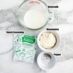 ingredients needed to make ranch seasoning on a marble counter top, including milk, sugar and eggs