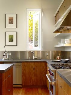 a kitchen with wooden cabinets and stainless steel appliances