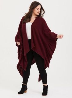 Stay warm with a stunning, ultra-soft ruana. The fabric feels plush and cozy and the ruffle trim adds a subtle feminine touch. Open front. Wrap sleeves. Ruffled trim . CONTENT + CARE: Polyester. Hand wash; dry flat. Imported plus size wrap. SIZE + FIT: Front: 27”W x 33”L. Back: 57” W x 37”L. Model is 5'11”. The best plus size women's burgundy ruffle edge ruana capes ponchos & ruanas in berry made of knit. Torrid is your destination for the freshest spring and summer styles. Ruana Wrap, Red Plaid Scarf, Cowl Neck Poncho, Black Faux Leather Jacket, She Is Clothed, Shrug Cardigan, Lace Kimono, Winter Looks, Ruffle Trim