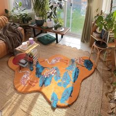 a living room filled with furniture and lots of plants on the floor next to a window