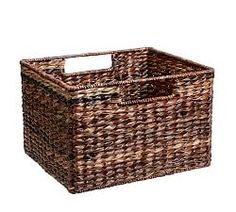 a brown basket with handles is shown on a white background for use as a storage container