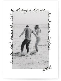 a black and white photo of two people playing in the water with an inscription above them