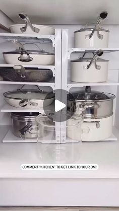 two shelves with pots and pans on them