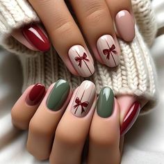 Embrace the holiday spirit with these elegantly simple Christmas nails, adorned with charming painted-on bows. Each hand displays five fingers, showcasing nails painted in soft, festive shades of red and green, complete with a glossy finish that enhances their sophisticated appeal. The highlight of this design is the minimalist bows painted directly onto one or two nails per hand. These bows are n#ChristmasNails #HolidayManicure #FestiveFingers #MerryManicure #NailArtInspiration #WinterNails #HolidayNailDesigns #ChristmasNailIdeas #NailGoals Simple Xmas Nails Red And Green, Christmas Nails Gift Design, Christmas Themed Gel Nails, Nail Red Ideas, Nail Idea Christmas, Nails Idea For Christmas, Nail Art Ideas For Christmas, Cute Nails Christmas Simple, Christmas Ideas For Nails