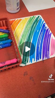 a tray with crayons sitting on top of a table