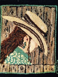 a close up of a rug with a woman wearing a hat