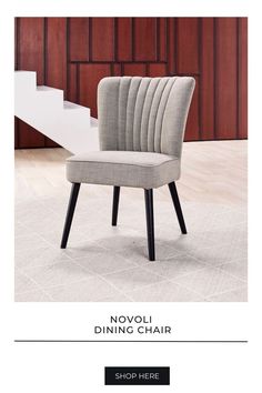 an upholstered dining chair with the words novoli dining chair on it