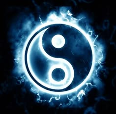 the yin symbol is shown in blue and black with clouds around it, on a dark background