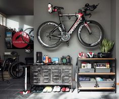 a bicycle mounted to the wall in a garage