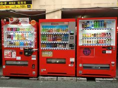 two red vending machines sitting next to each other