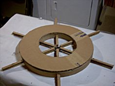 a wooden object sitting on top of a white table